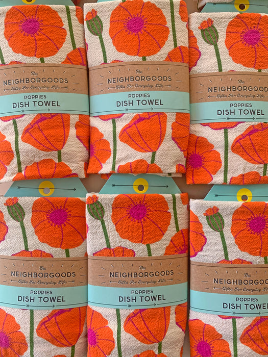 Poppies dish towels packaged in The Neighborgoods branded ready-to-gift belly band sleeves.
