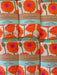 Screen-printed Poppies dish towels packaged in branded belly band sleeves
