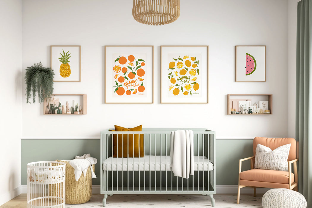 Lemons and Oranges prints in large sizes framed above a couch in a child's bedroom