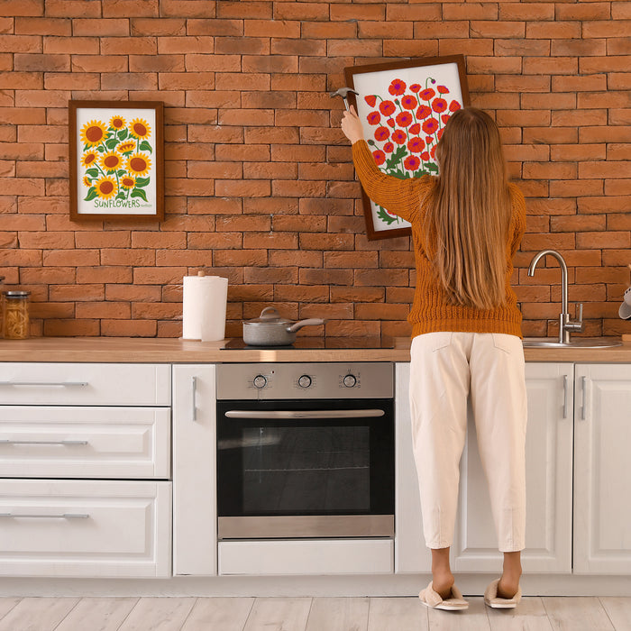 Sunflower and Poppies Neighborgoods prints being hung up in a kitchen