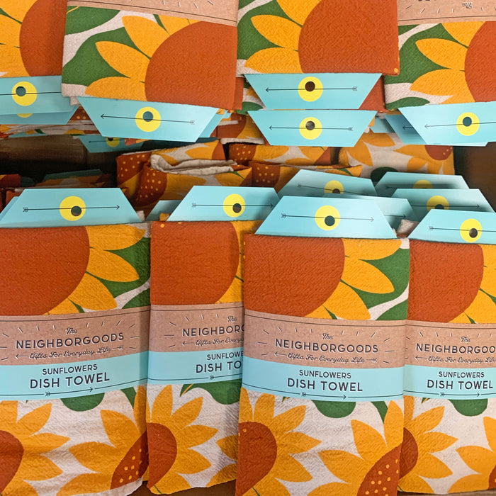 Front view of The Neighborgoods Sunflowers dish towel in a ready-to-gift sleeve.