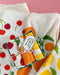 Fruit stand dish towel set photographed with cherry and lemon dish towels