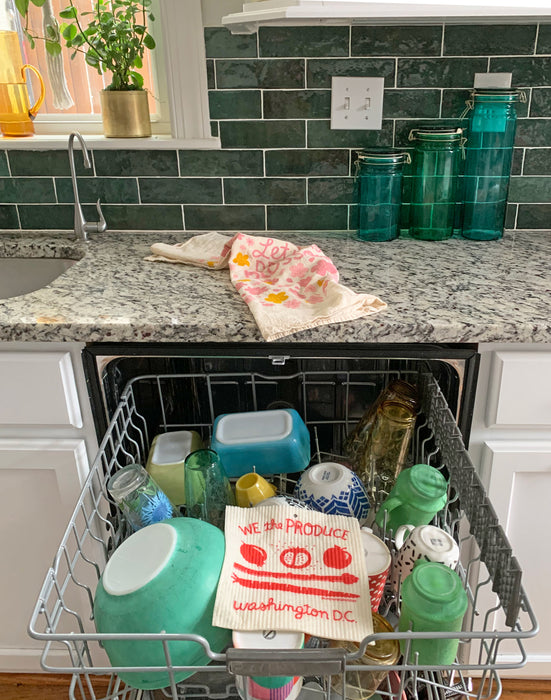 DC sponge cloth placed in the top rack of a dishwasher to be cleaned
