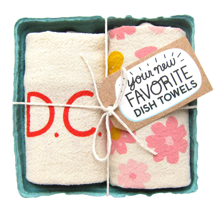 DC love dish towel set, folded in a green berry basket tied with a gift tag