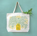 Dill tote holding produce, hanging on a wall
