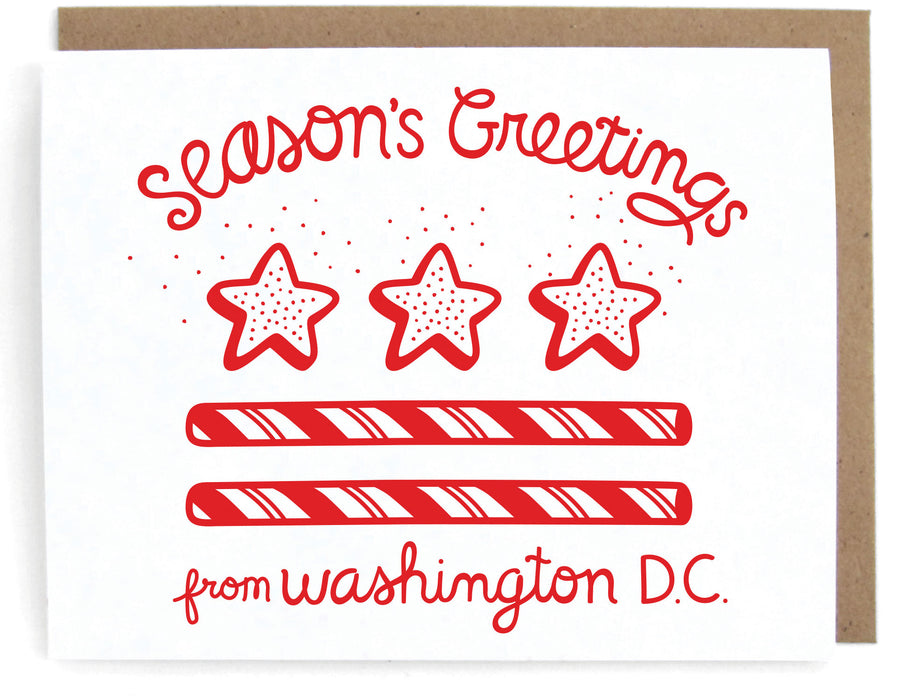 White card with DC flag holiday design, featuring the phrase "Season's greetings," with a brown envelope