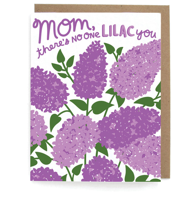 White card that pictures purple lilac flowers, featuring the phrase "Mom, there's no one lilac you" with a brown envelope