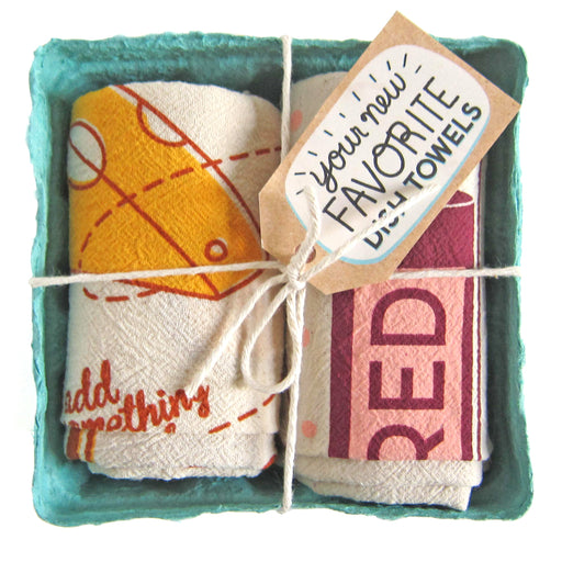 Perfect pairing dish towel set, folded in a green berry basket tied with a gift tag