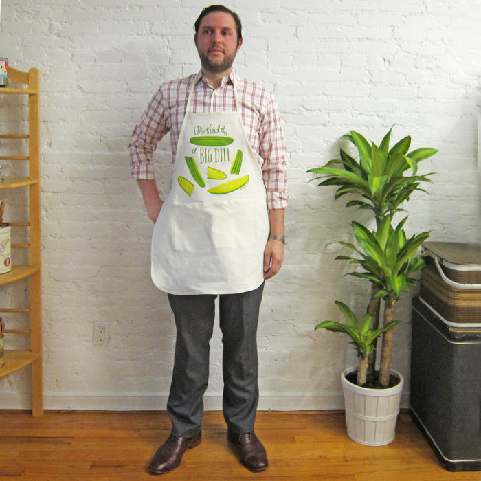 A man wearing the pickle apron