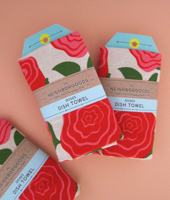 The Neighborgoods Roses dish towel packaged in ready-to-gift sleeve.