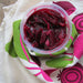 Bowl of beets on top of a beet dish towel.