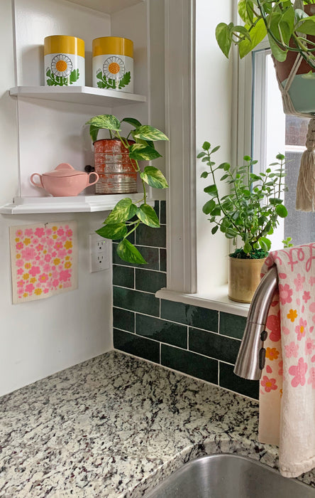 Blossom sponge cloth hung up by the kitchen sink