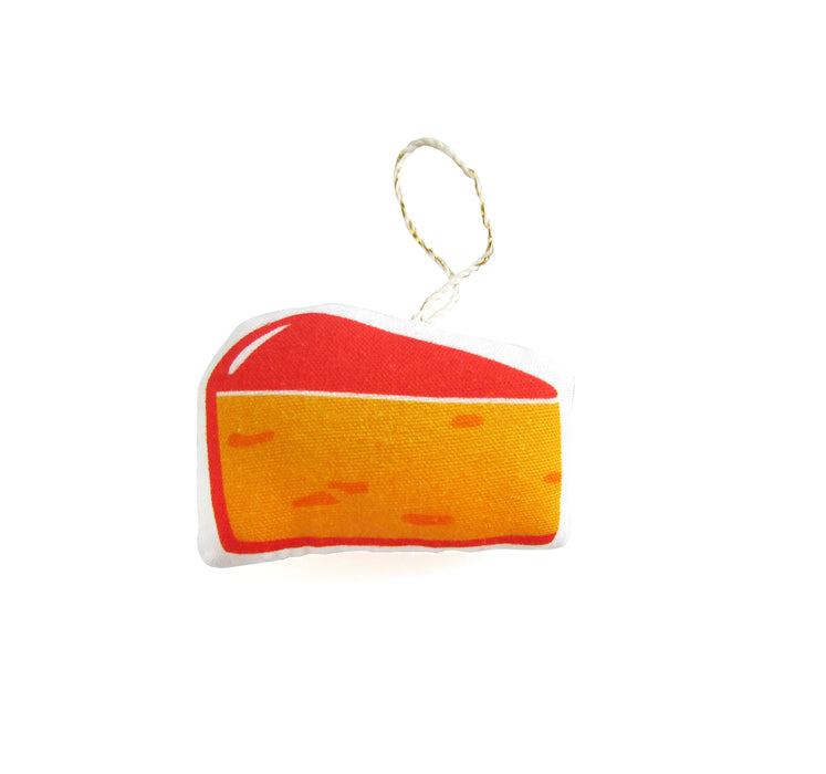 Side 2 if cheese ornament, featuring a red rind