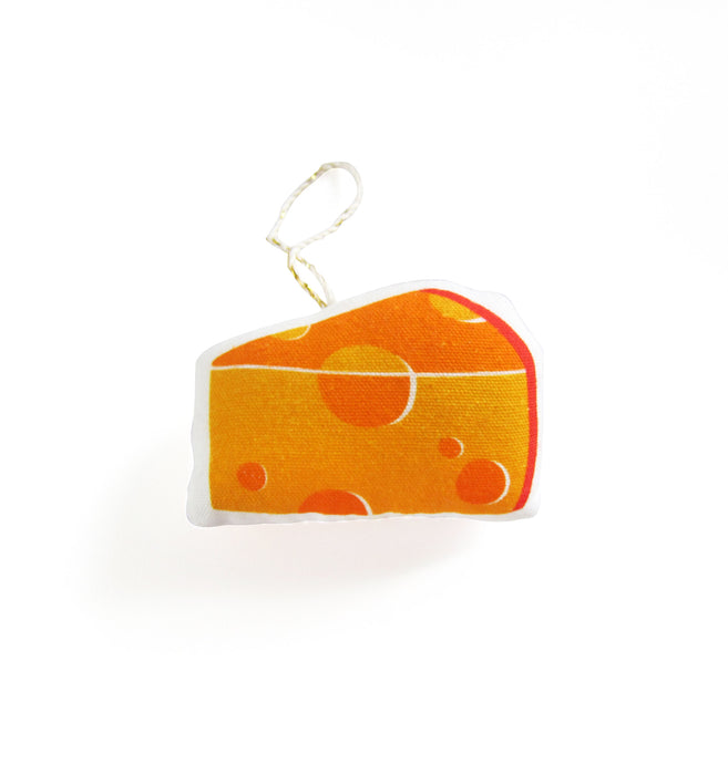 Side 1 of cheese ornament, patterned like swiss