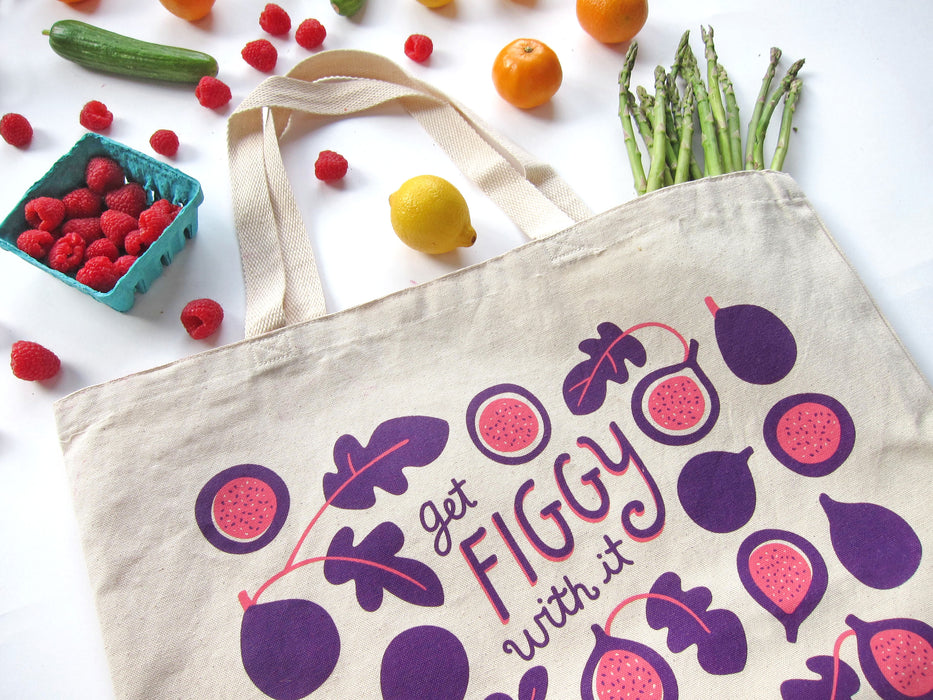 Figgy tote bag photographed at an angle with an array of produce