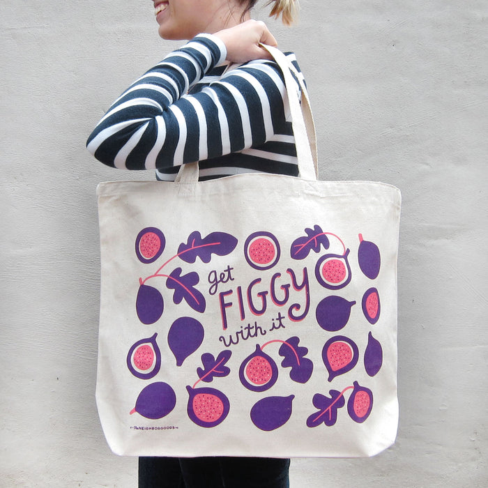 Person in a striped shirt carrying the figgy tote bag