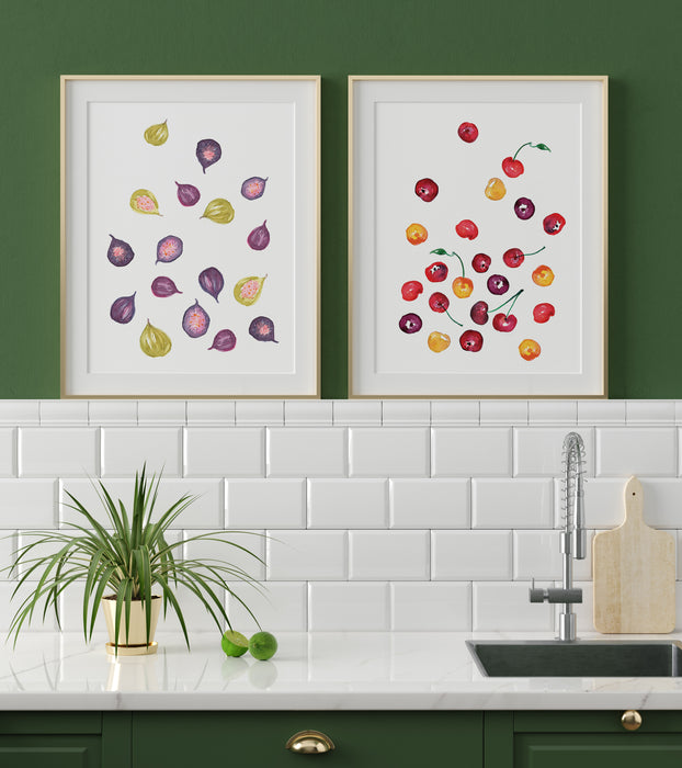 Watercolor Figs and Watercolor Cherries prints framed above a sink in a kitchen