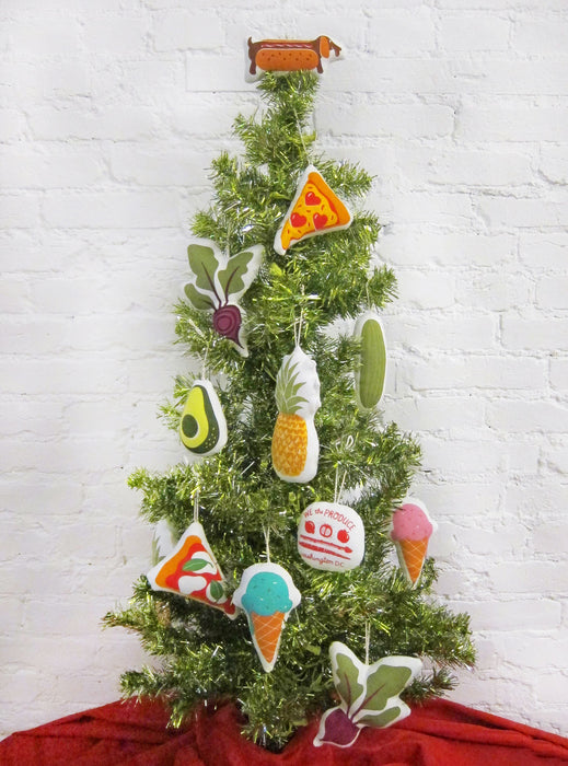 Ice cream ornament pictured on a small tree with an array of other Neighborgoods ornaments