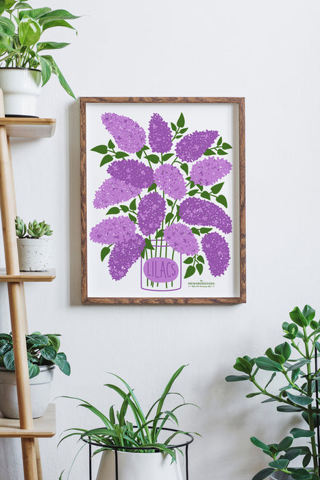 Marigolds print in medium size framed amongst several houseplants