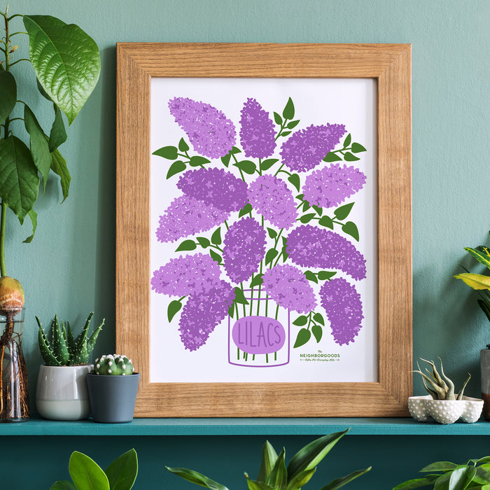 Marigolds print in medium size framed amongst several houseplants