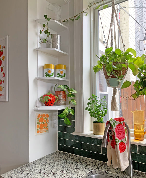 Marigold sponge cloth hung up by the kitchen sink