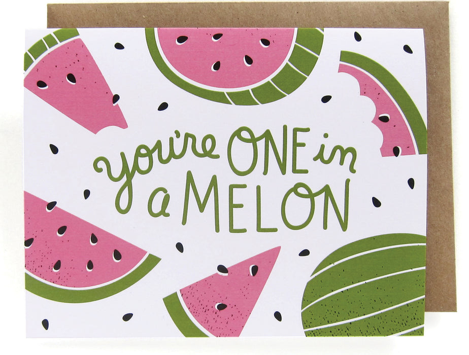 White card with a watermelon design, featuring the phrase "You're one in a melon," with a brown envelope