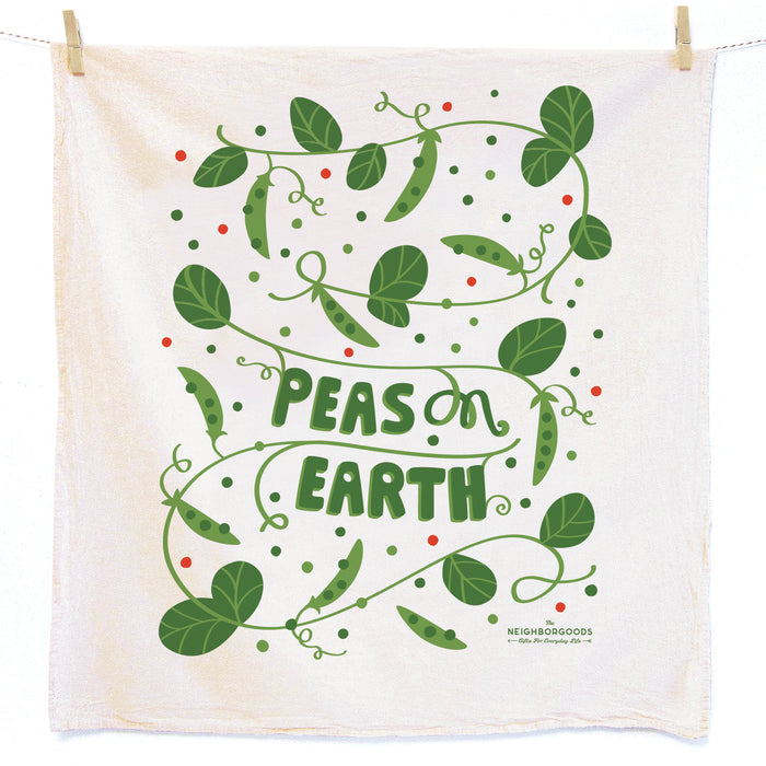 Cotton dish towel with peas design, featuring the phrase "Peas on earth"