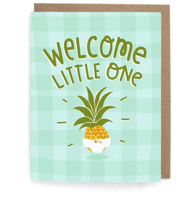Lught green checkered card that pictures a pineapple in a diaper, featuring the phrase "Welcome little one," with a brown envelope