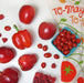 Red colored fruits and veggies pictured alongside tomato dish towel