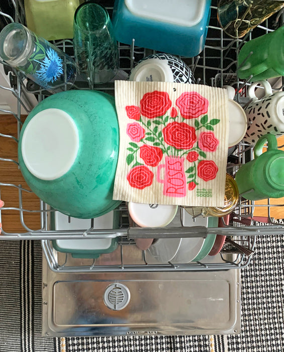 Roses sponge cloth placed in the top rack of a dishwasher to be cleaned