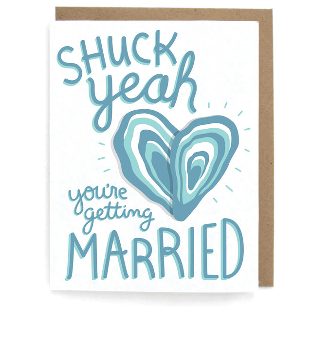 White card with heart shaped oyster design, featuring the phrase "Shuck yeah you're getting married," with a brown envelope
