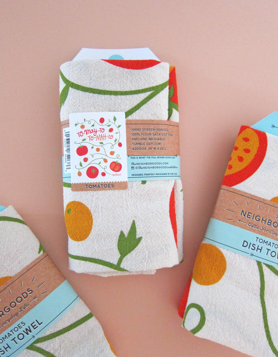 Back view of tomato dish towel packaged in branded belly bad sleeve