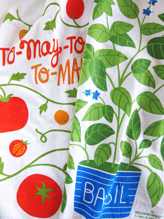 Tomato and basil dish towels folded together