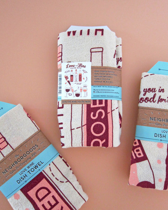 Back view of three wine dish towels individually packaged in branded belly band sleeves.