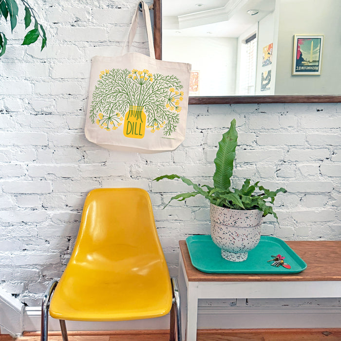 Dill tote bag hanging on a mirror hook.