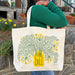 A woman carrying the Dill tote bag over her shoulder.