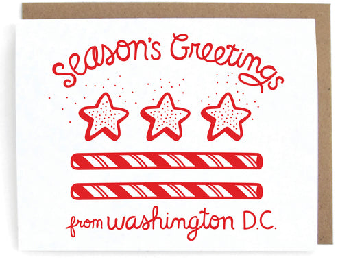White card with DC flag holiday design, featuring the phrase "Season's greetings," with a brown envelope