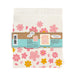 Back of matching dish towel and sponge cloth set with blossoms design, featuring the phrase "Let your dreams blossom"