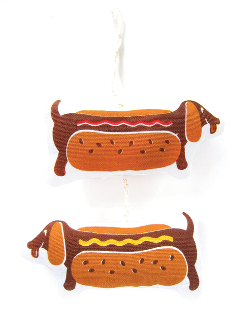 Soft ornament of a dachshund in a hot dog costume; Side 1 with ketchup, Side 2 with mustard  