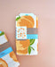 Back view of packaged Peach dish towel