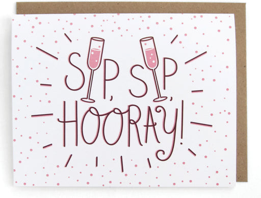 White card with pink bubbly drink design, featuring the phrase "Sip sip hooray," with a brown envelope